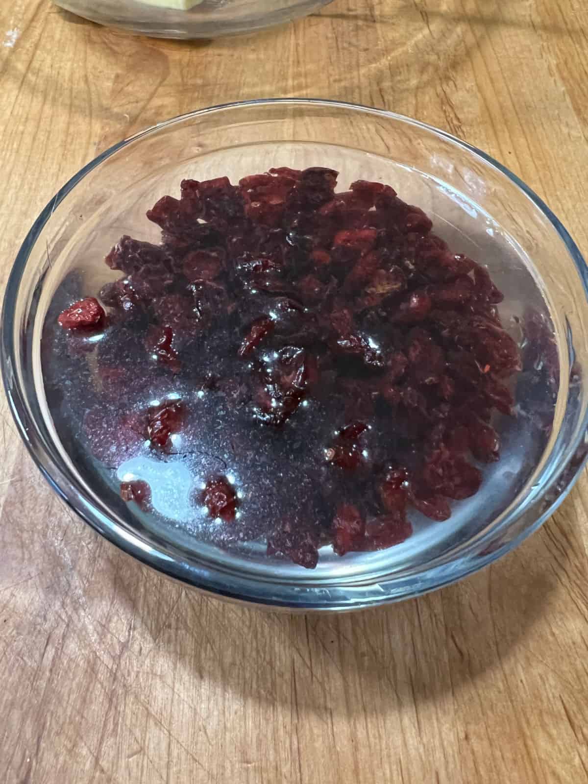 Dried cranberries soaking in water.
