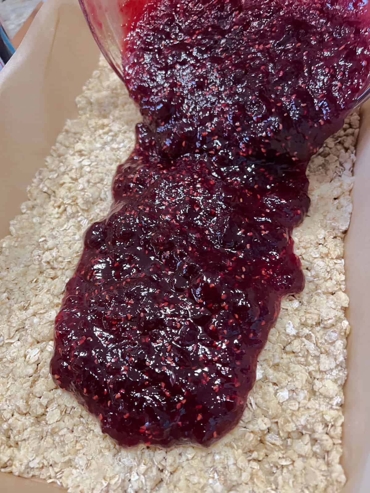 Pouring jam mixture into the pan.