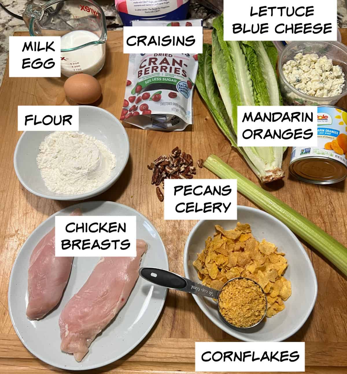 Ingredients: milk, egg, flour, chicken breasts, cornflakes, pecans, celery, mandarin oranges, Craisins, blue cheese, and lettuce.