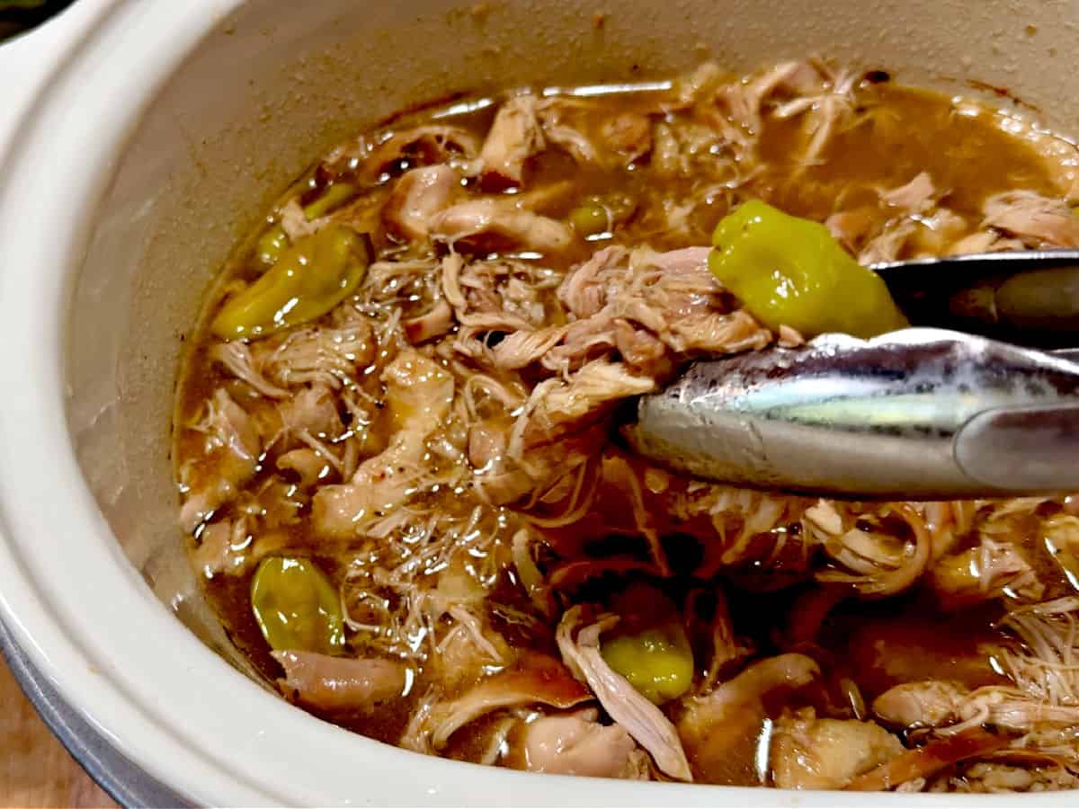 shredded chicken in the crock pot ready to serve.