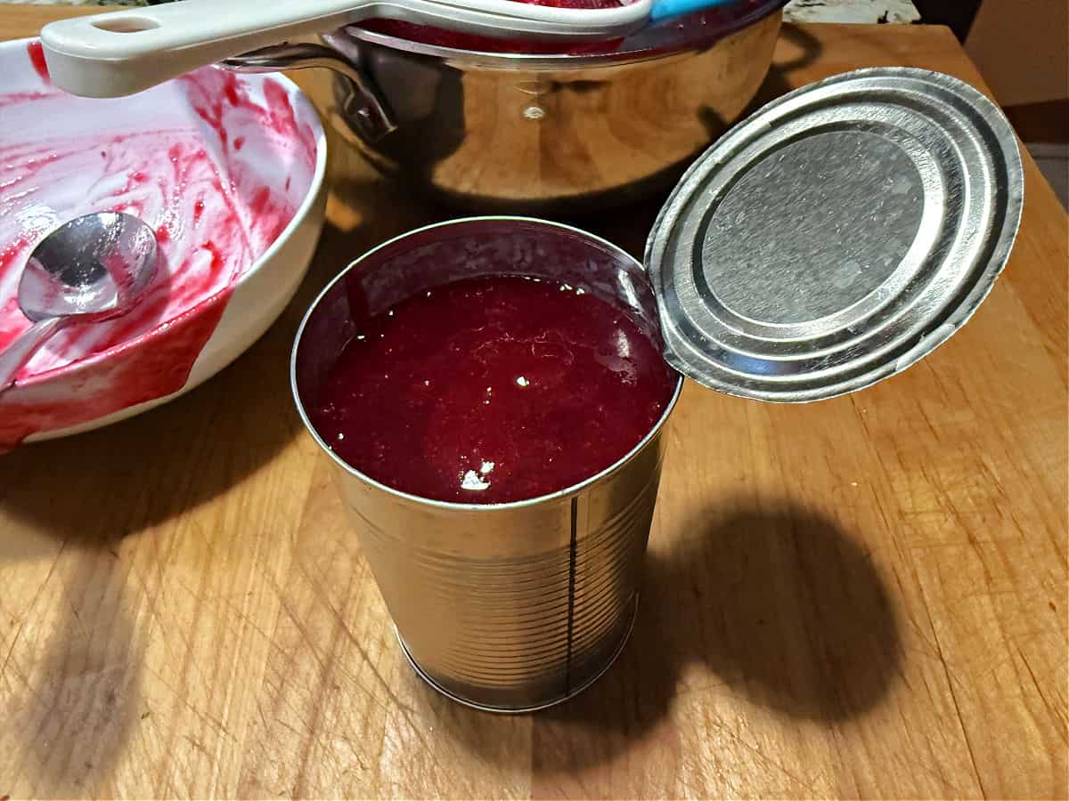 warm sauce poured into a can to use it as a mold.