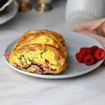 slices of breakfast egg bake with braided puff pastry ready to eat.