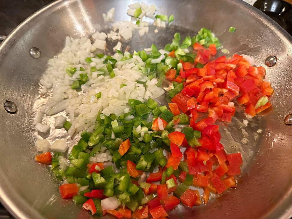 Sauteing the bell peppers and onion.