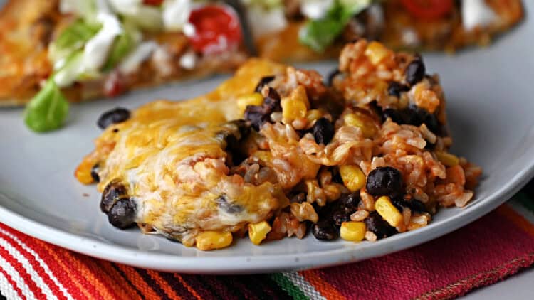 A serving of brown rice and black beans casserole ready to eat.