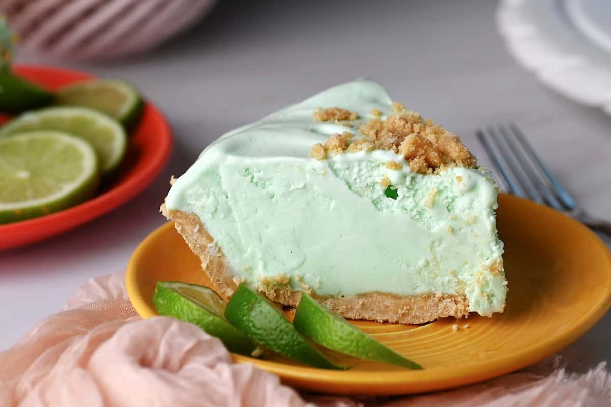 A slice of frozen lime pie ready to enjoy.