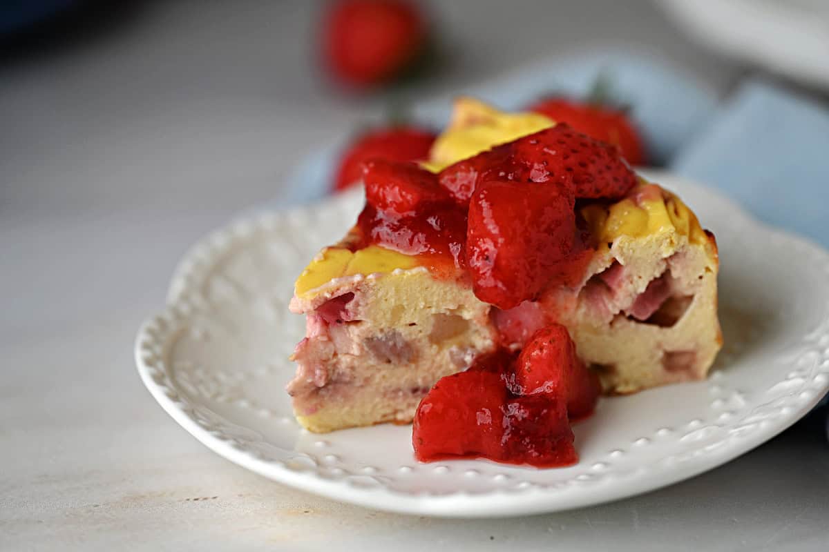 a slice of greek yogurt cake with strawberry sauce.