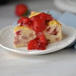 a slice of greek yogurt cake with strawberry sauce.