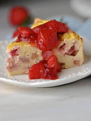 a slice of greek yogurt cake with strawberry sauce.
