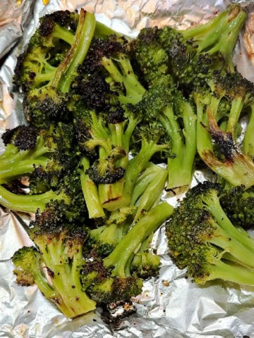 grilled broccoli in a foil packet, ready to eat.