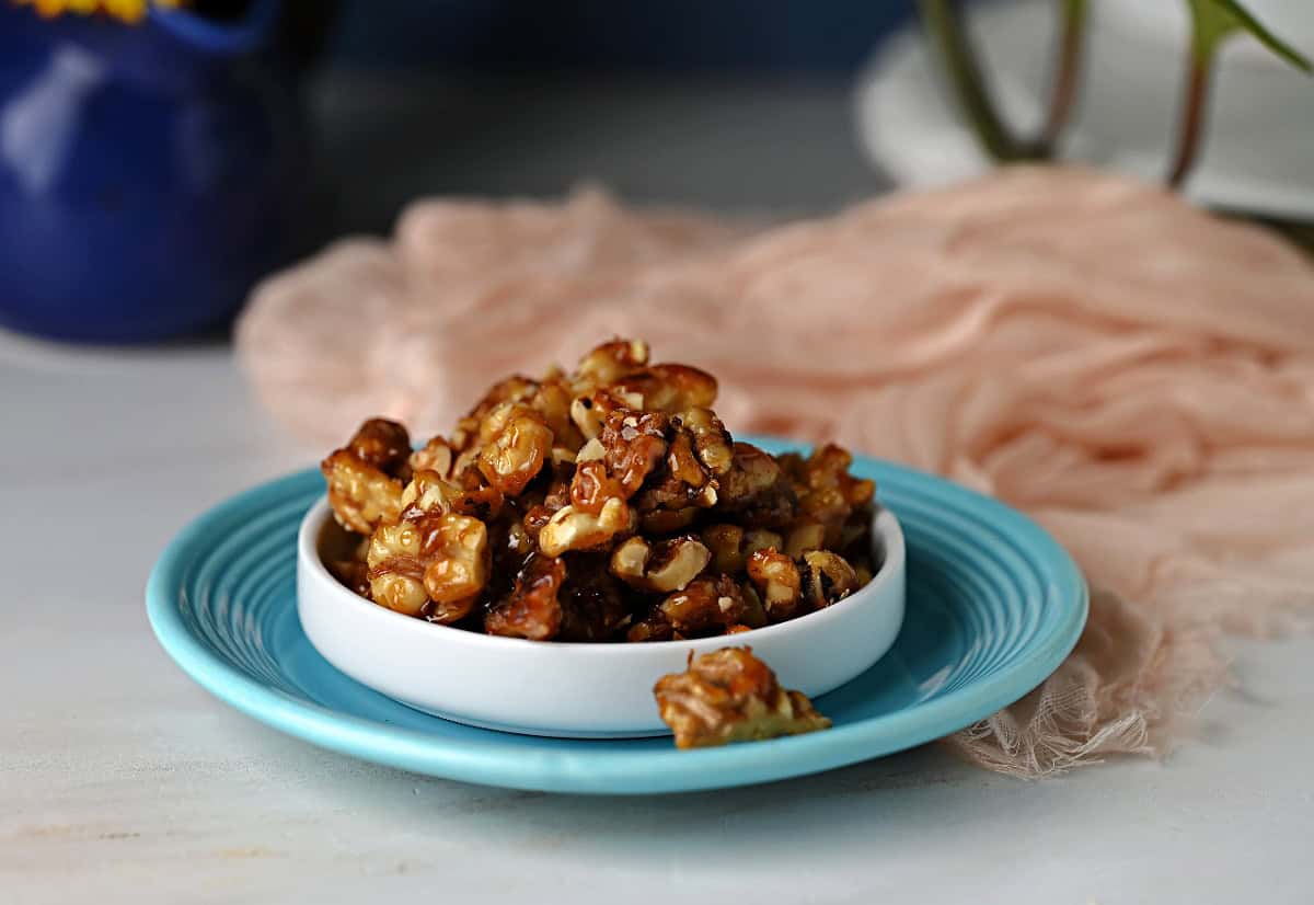 a dish of candied walnuts ready to enjoy.