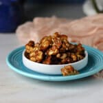 a dish of candied walnuts ready to snack on or add to a salad.