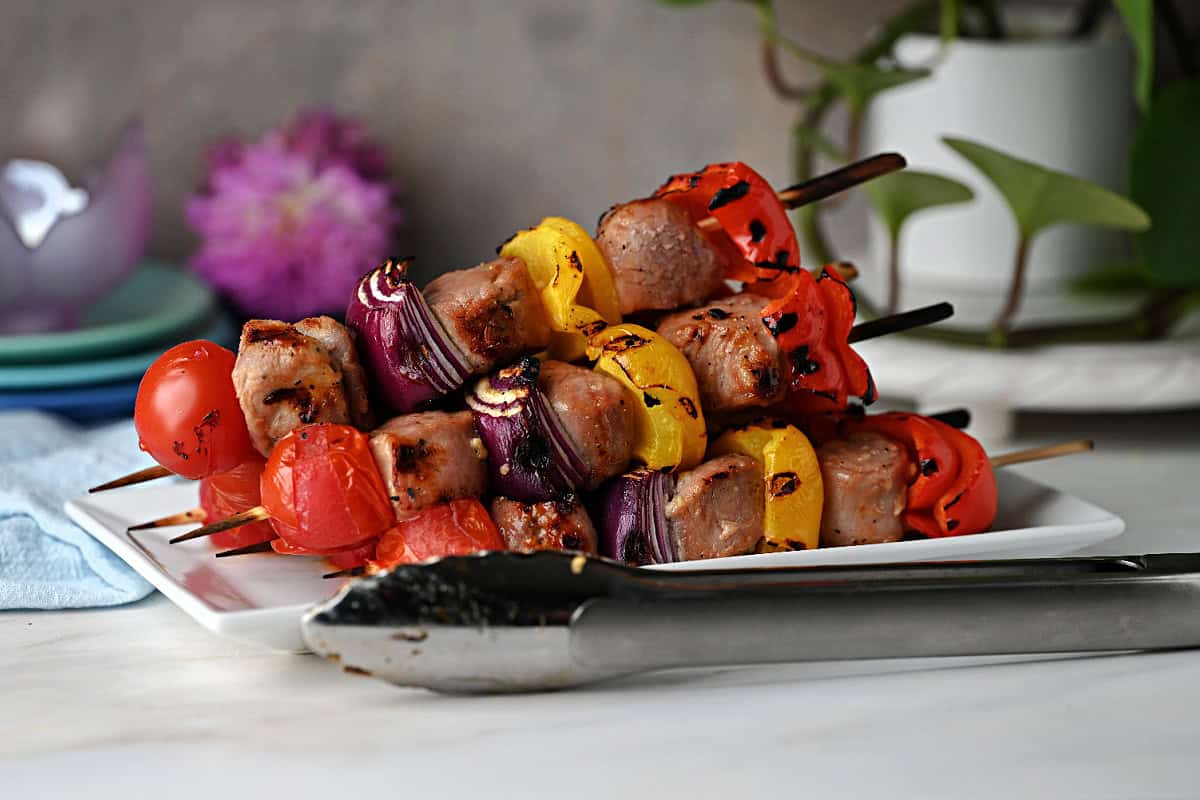 A stack of grilled pork skewers ready to serve.