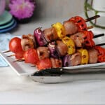 A plate of cooked pork kabobs ready to serve.