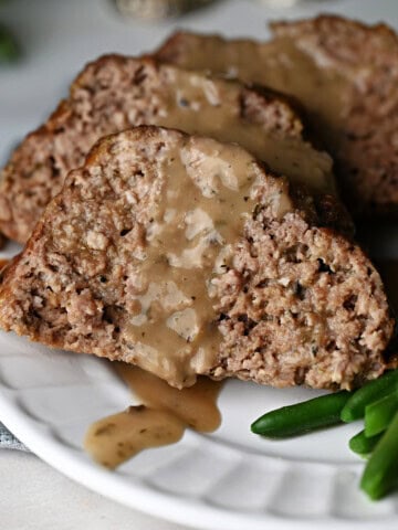 Old fashioned meatloaf drizzled with juicy gravy.