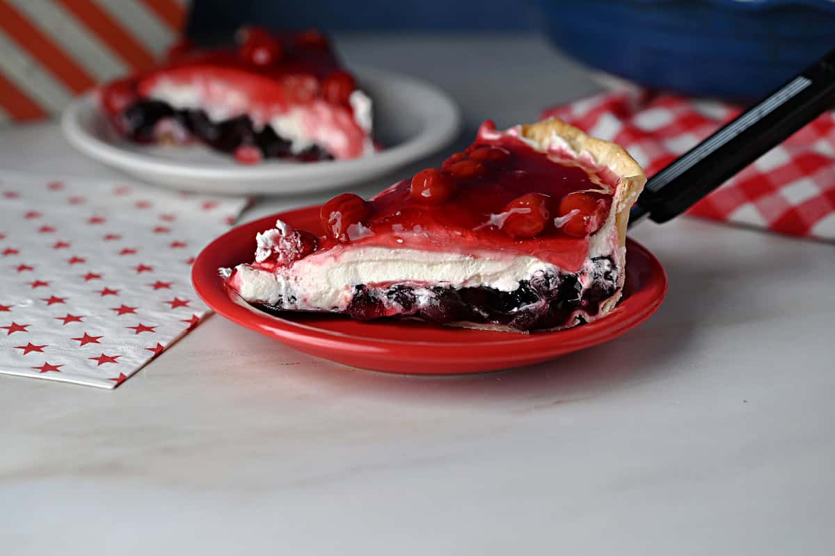 a slice of the layered red white and blue pie, showing the layers.