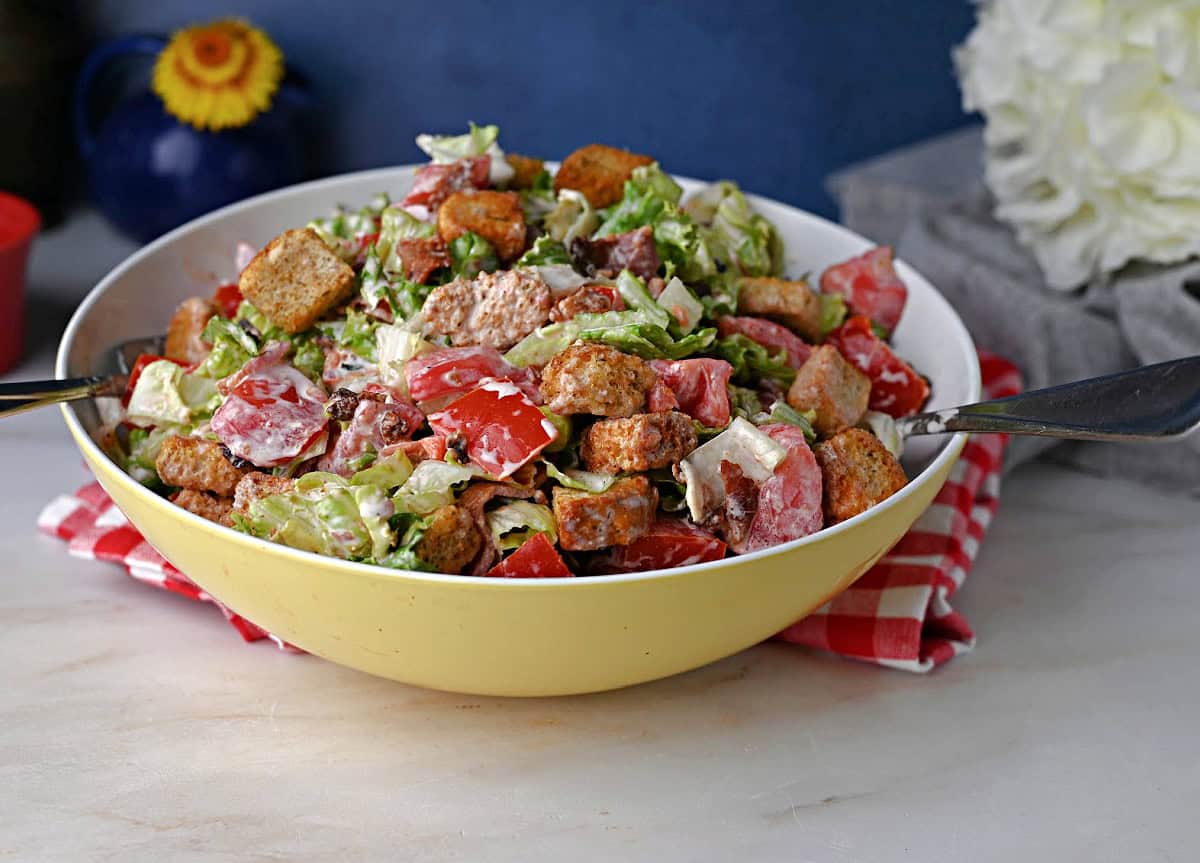 a serving bowl full of BLT salad ready to eat.