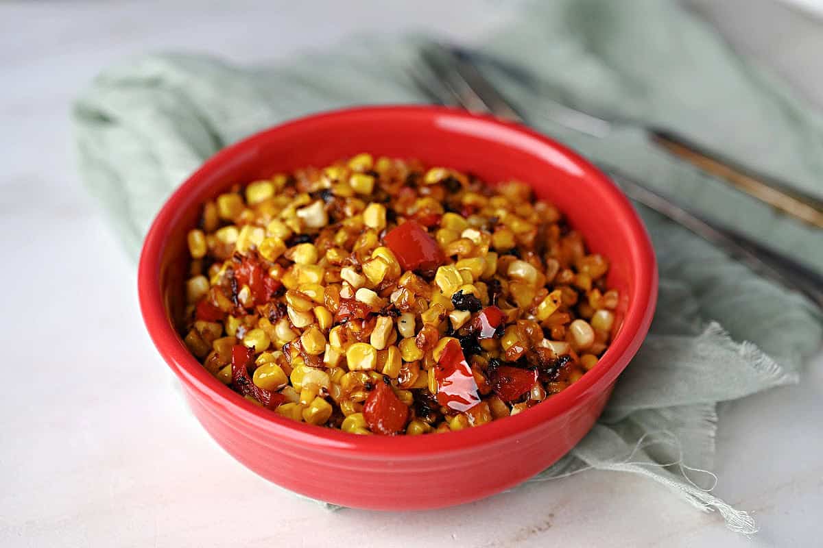 a bowl of skillet roasted corn ready to serve.