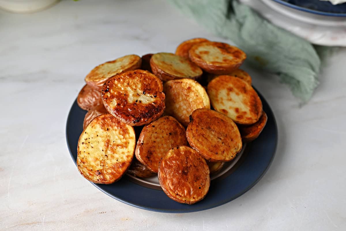 a plate of air fryer roasted baby potatoes ready to eat.