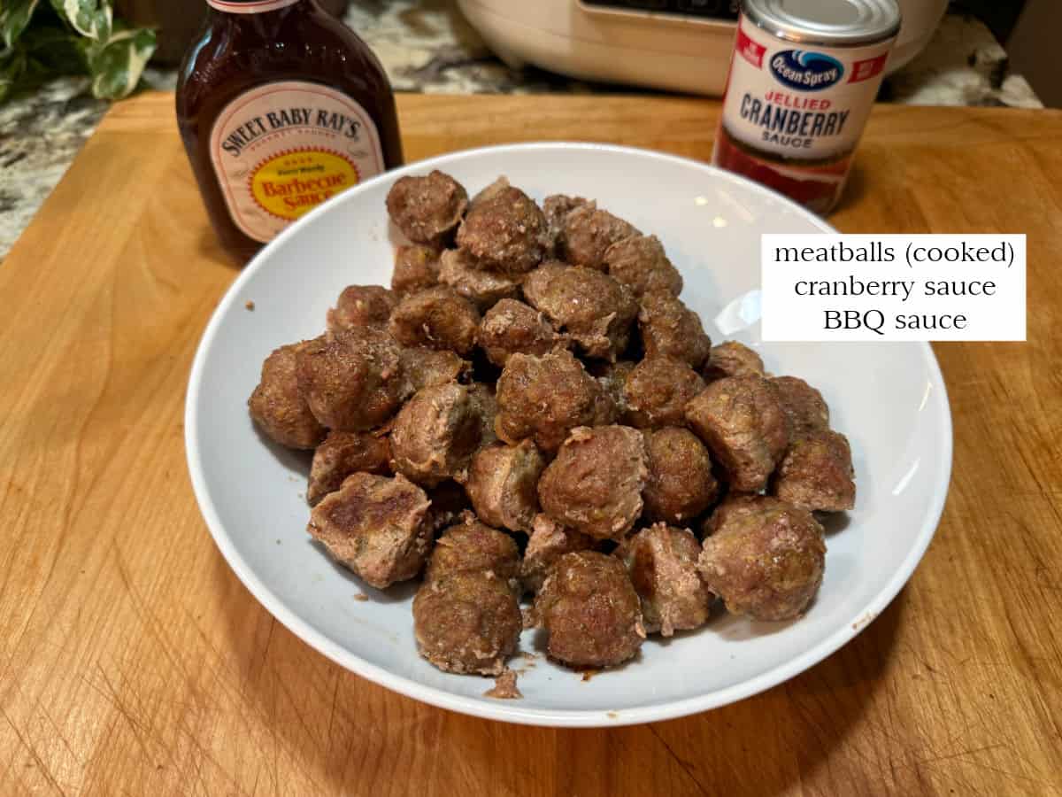 ingredients: BBQ sauce, cranberry sauce, and cooked meatballs.