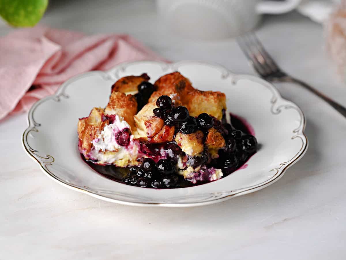a serving of blueberry french toast bake made with croissants.